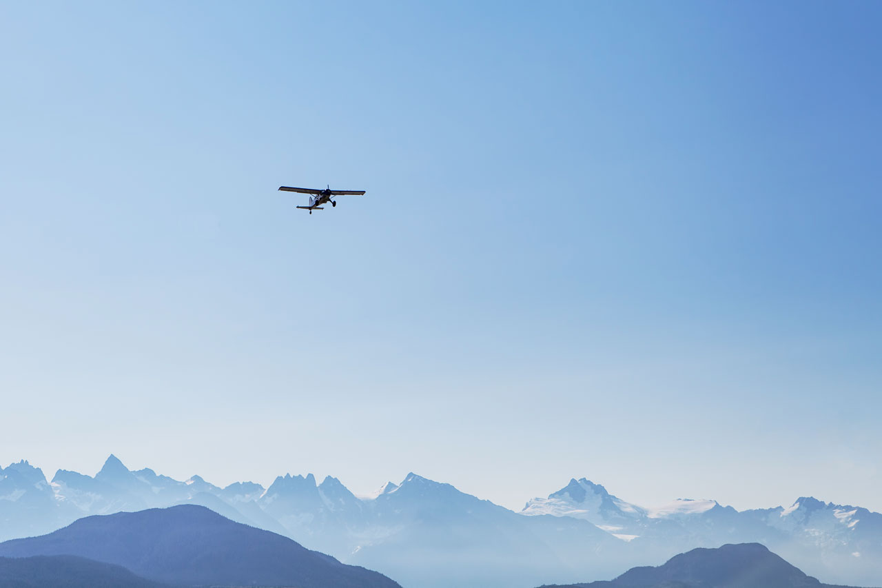 Cessna 172 over snowy mountains