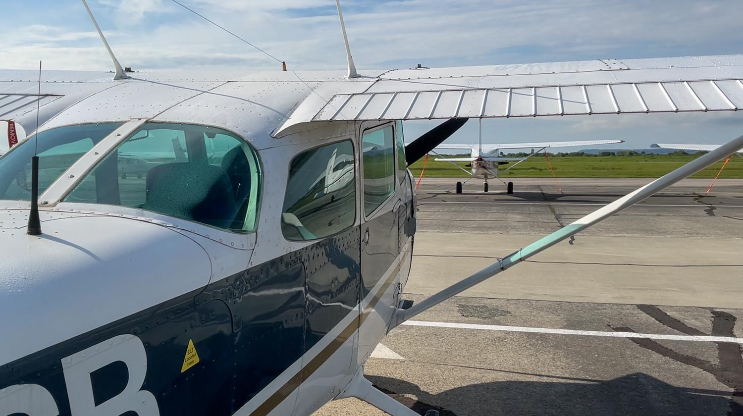 The wing strut on a Pacific Flying Club Cessna 172, showing the diagonal brace connecting the wing to the fuselage