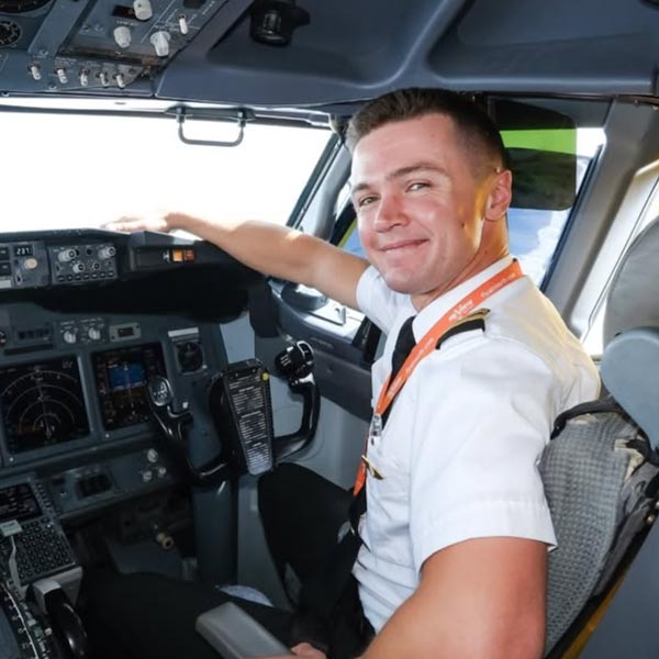 Dylan in cockpit at Air North