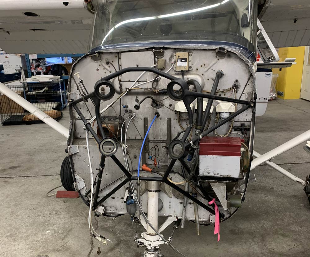 Cessna 152 in the hangar with engin taken out for maintenance