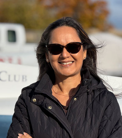 Parkash Bains in front of a Cessna
