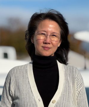 Juliana Sutanto min front of a Cessna